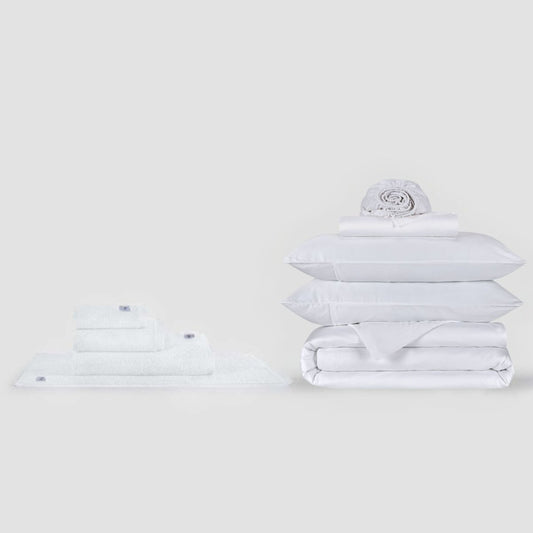 White complete bed sheets set and towel collection by Momo Cotton displayed on neutral background